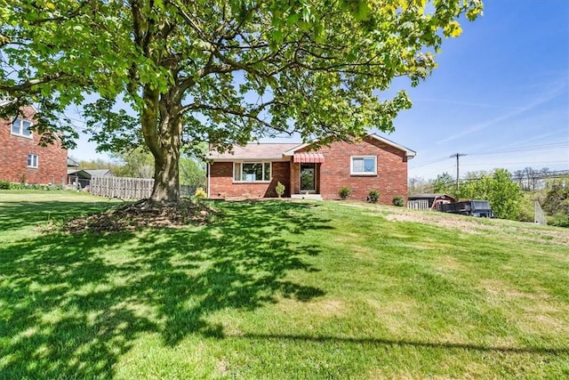 2410 Nicholson Rd, Franklin Park, PA 15143 - ranch-style home with brick siding, fence, and a front yard