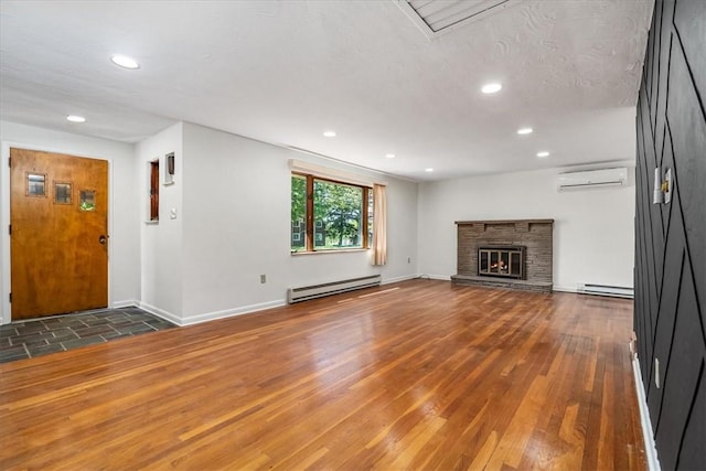 2410 Nicholson Rd, Franklin Park, PA 15143 - unfurnished living room with recessed lighting, a wall mounted air conditioner, and a baseboard radiator