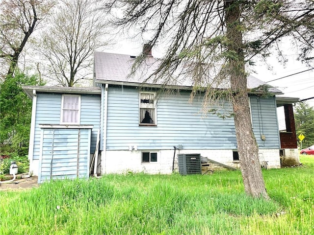 rear view of house with cooling unit