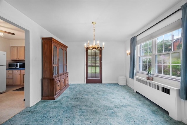 4044 Cloverlea St, Brentwood, PA 15227 - unfurnished dining area with baseboards, radiator heating unit, a notable chandelier, and light carpet