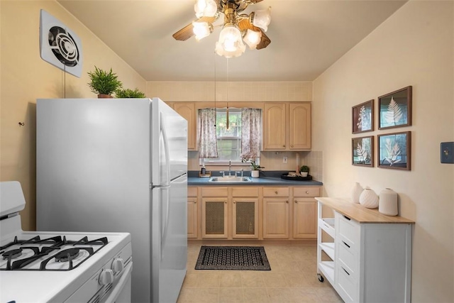 4044 Cloverlea St, Brentwood, PA 15227 - kitchen with a sink, white gas range oven, light tile patterned flooring, light brown cabinets, and a ceiling fan