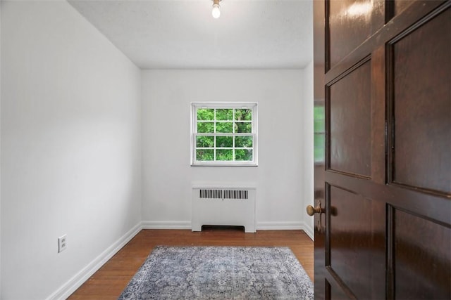 4044 Cloverlea St, Brentwood, PA 15227 - entryway with baseboards, radiator heating unit, and wood finished floors