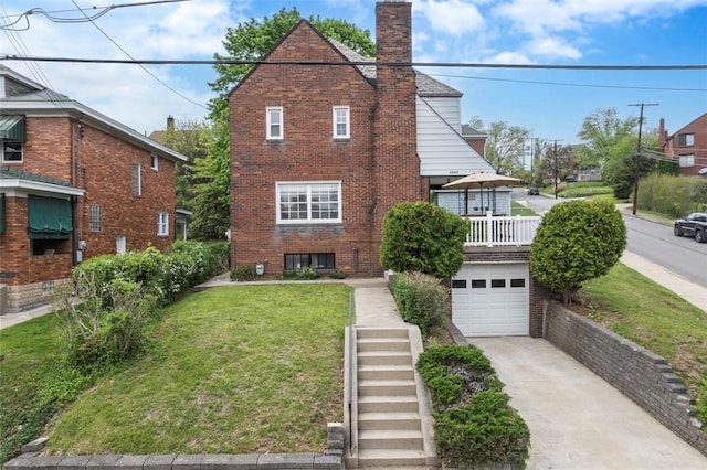 4044 Cloverlea St, Brentwood, PA 15227 - tudor home with a front lawn, a chimney, brick siding, an attached garage, and driveway