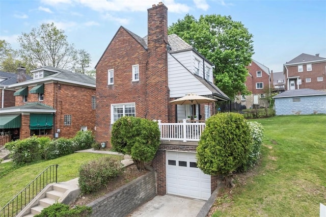 4044 Cloverlea St, Brentwood, PA 15227 - back of property with a yard, brick siding, concrete driveway, and a chimney