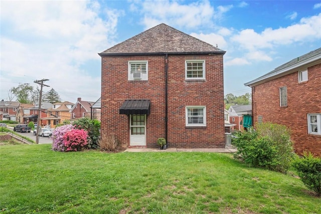 4044 Cloverlea St, Brentwood, PA 15227 - rear view of house with a yard and brick siding