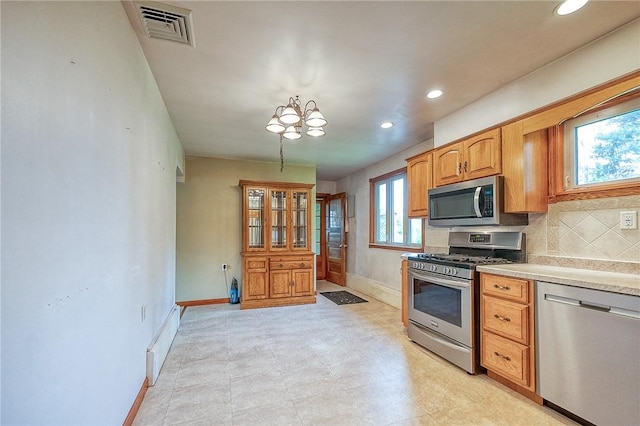 kitchen with visible vents, recessed lighting, baseboards, and stainless steel appliances