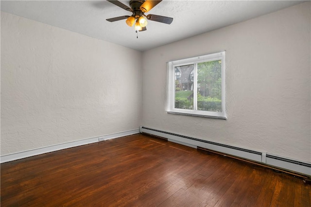 empty room with a textured wall, ceiling fan, dark wood finished floors, baseboards, and a baseboard radiator