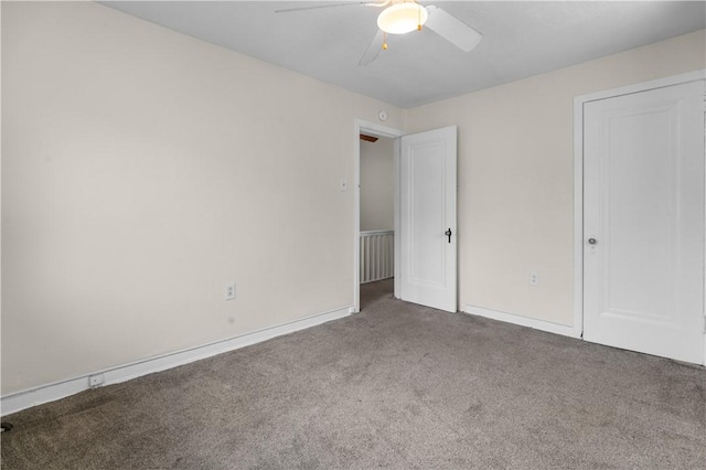 unfurnished bedroom featuring baseboards, carpet, and ceiling fan