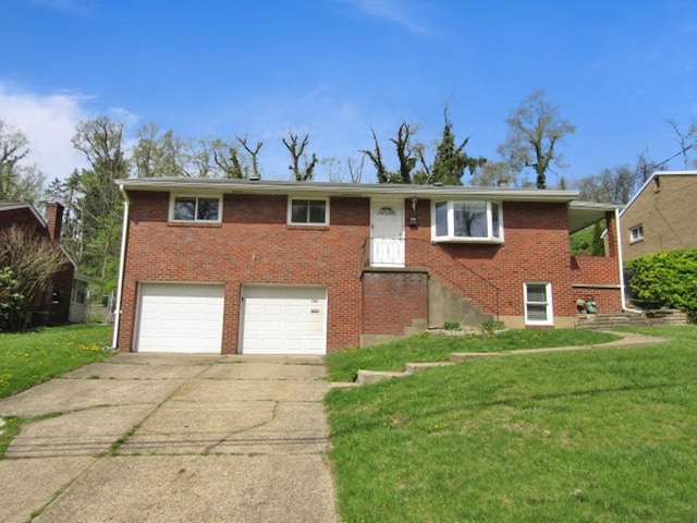 view of front of property featuring concrete driveway, an attached garage, brick siding, and a front yard