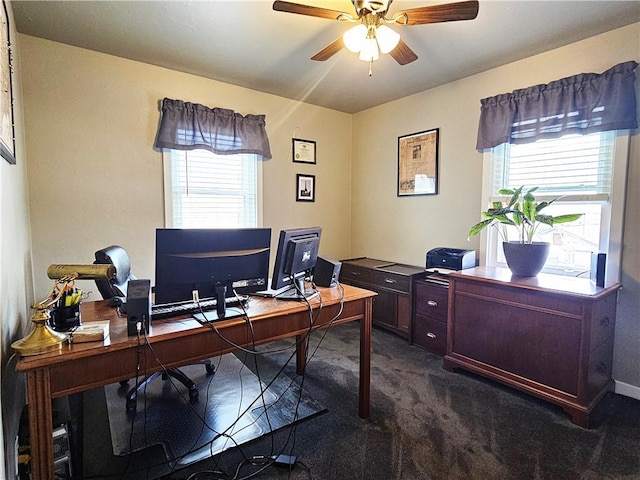 office with dark colored carpet, ceiling fan, and a wealth of natural light