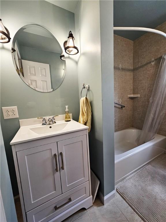 full bathroom featuring vanity and shower / bathtub combination with curtain