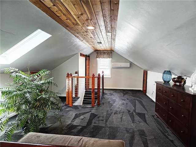 bonus room with baseboards, carpet flooring, lofted ceiling with skylight, and an AC wall unit