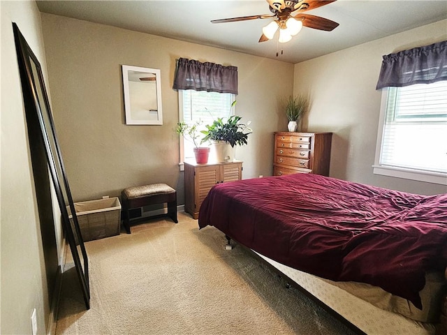 bedroom featuring light carpet