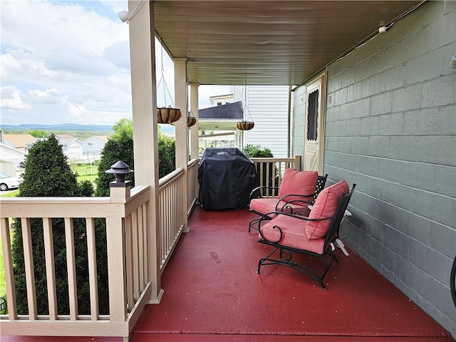 exterior space with a porch and a grill