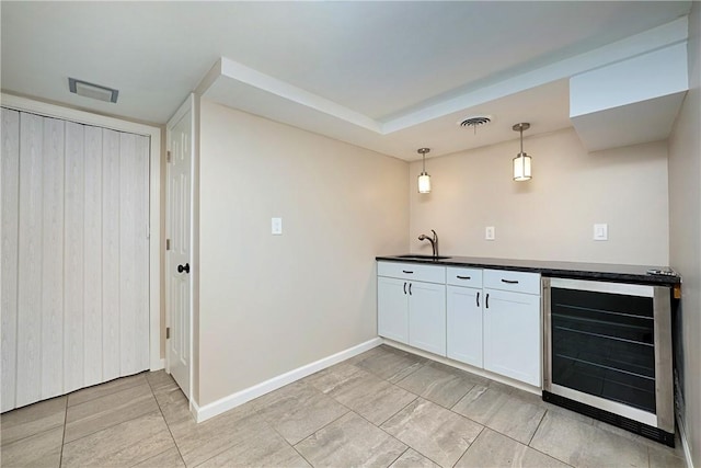 4917 Leona Dr, Baldwin Boro, PA 15227 - bar featuring pendant lighting, beverage cooler, baseboards, indoor bar, and a sink