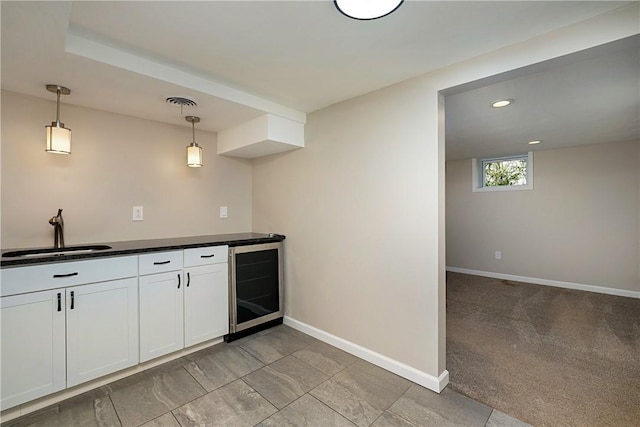 4917 Leona Dr, Baldwin Boro, PA 15227 - kitchen featuring a sink, baseboards, pendant lighting, and wine cooler