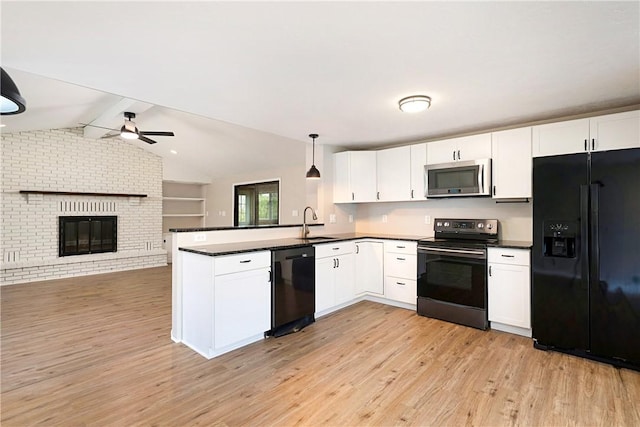 4917 Leona Dr, Baldwin Boro, PA 15227 - kitchen featuring a sink, dark countertops, black appliances, and a peninsula