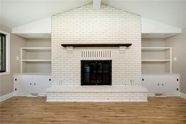 4917 Leona Dr, Baldwin Boro, PA 15227 - interior details featuring built in features, baseboards, a brick fireplace, and wood finished floors