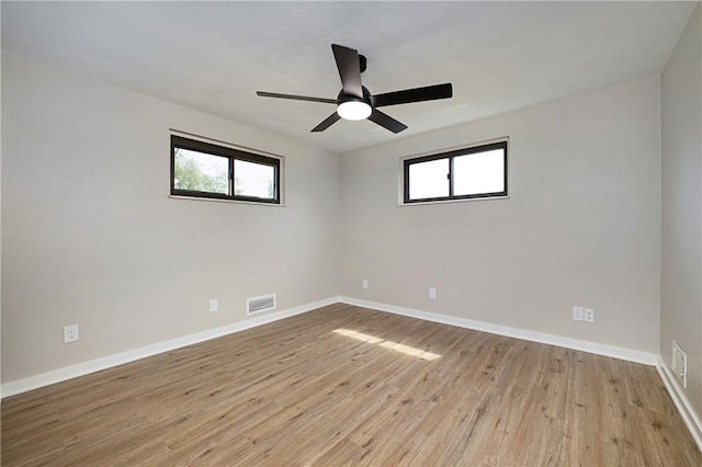 4917 Leona Dr, Baldwin Boro, PA 15227 - spare room featuring visible vents, plenty of natural light, ceiling fan, and wood finished floors