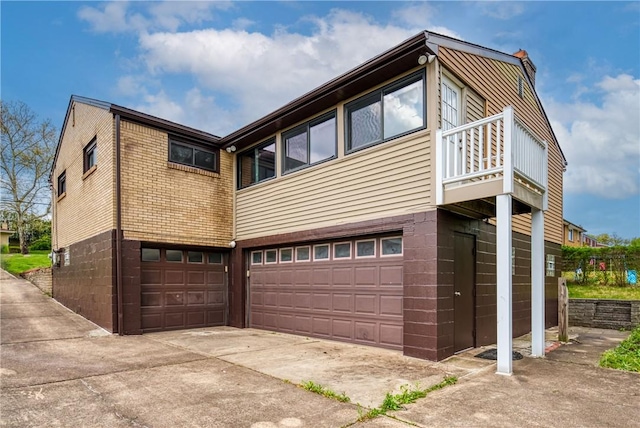 4917 Leona Dr, Baldwin Boro, PA 15227 - exterior space with an attached garage, concrete driveway, and a balcony
