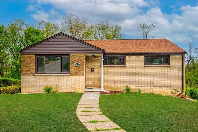 4917 Leona Dr, Baldwin Boro, PA 15227 - view of front of property featuring brick siding, a shingled roof, and a front yard
