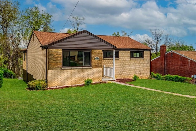 4917 Leona Dr, Baldwin Boro, PA 15227 - view of front facade featuring a front lawn and brick siding