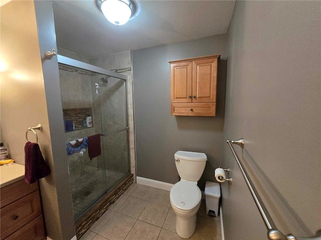 full bathroom featuring toilet, baseboards, a shower stall, and tile patterned flooring