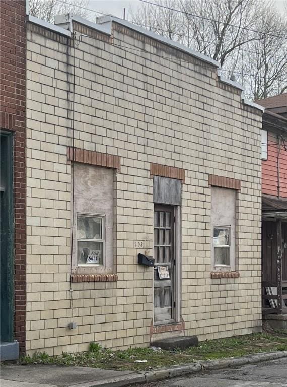 view of property exterior with brick siding