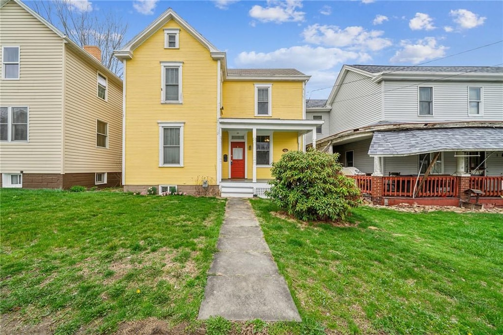 26 2nd Ave, Scottdale, PA 15683 - traditional-style house with a front lawn and covered porch