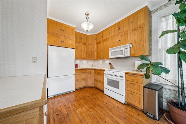 kitchen featuring ornamental molding, white appliances, wallpapered walls, light wood-type flooring, and light countertops