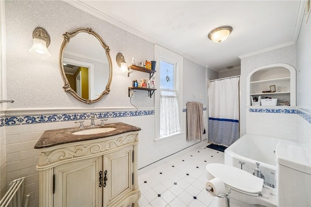 bathroom with crown molding, vanity, wainscoting, tile walls, and a shower with shower curtain
