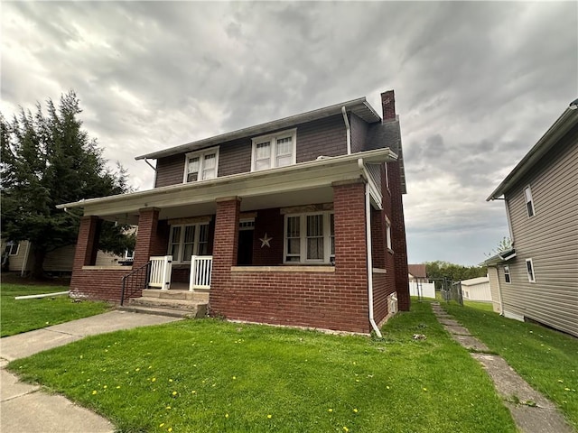 206 S State, St, PA 16222 - bungalow-style home with covered porch, brick siding, a chimney, and a front yard