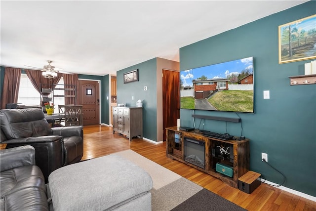 303 Ilex Dr, Ross Twp, PA 15237 - living area with wood finished floors, ceiling fan, and baseboards