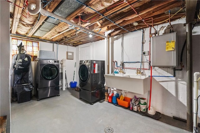 303 Ilex Dr, Ross Twp, PA 15237 - below grade area with washing machine and dryer, a sink, and electric panel