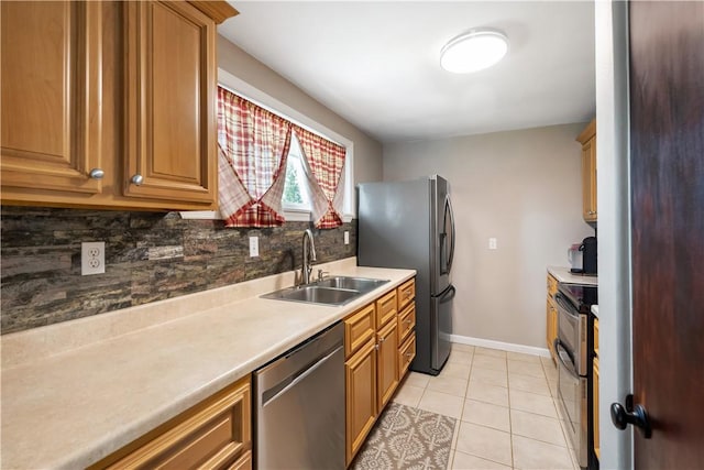 303 Ilex Dr, Ross Twp, PA 15237 - kitchen featuring stainless steel appliances, a sink, backsplash, light tile patterned floors, and baseboards