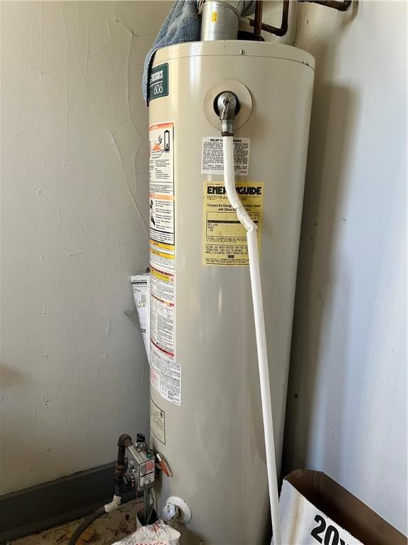 utility room with water heater