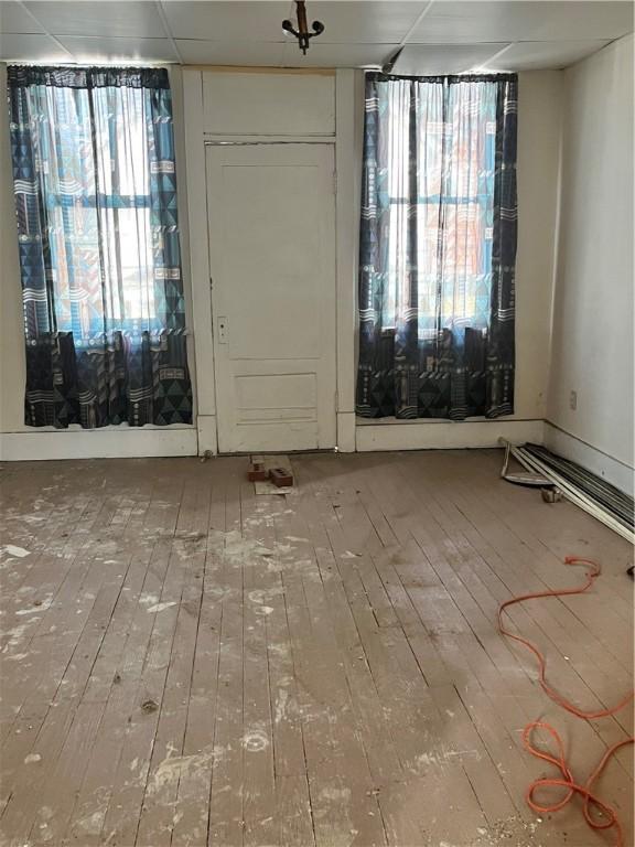 empty room featuring wood-type flooring