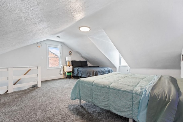 carpeted bedroom with a textured ceiling, baseboards, and lofted ceiling