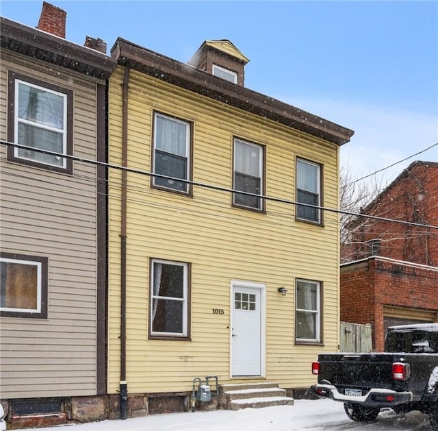 view of front of property with entry steps