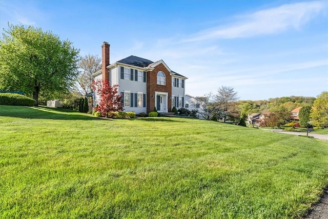 4012 Forest Dr, Hopewell Twp Bea, PA 15001 - view of front of home featuring a chimney, brick siding, and a front yard