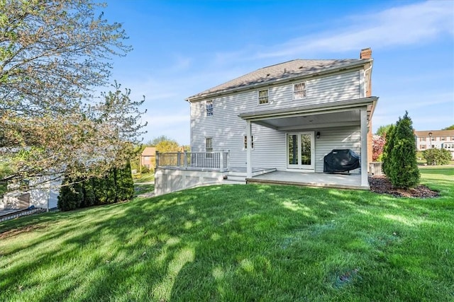 4012 Forest Dr, Hopewell Twp Bea, PA 15001 - back of property featuring a lawn, a patio area, and a chimney