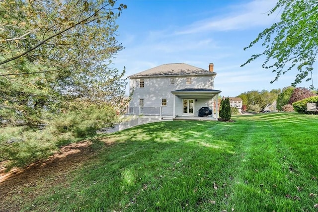 4012 Forest Dr, Hopewell Twp Bea, PA 15001 - rear view of house with a patio, a yard, and a chimney