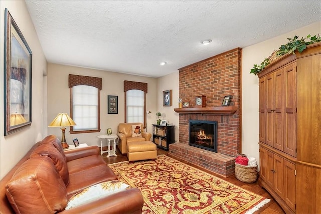 4012 Forest Dr, Hopewell Twp Bea, PA 15001 - living area featuring recessed lighting, a brick fireplace, light wood finished floors, and a textured ceiling