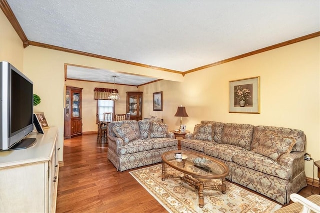 4012 Forest Dr, Hopewell Twp Bea, PA 15001 - living room featuring baseboards, a chandelier, ornamental molding, and light wood-style flooring