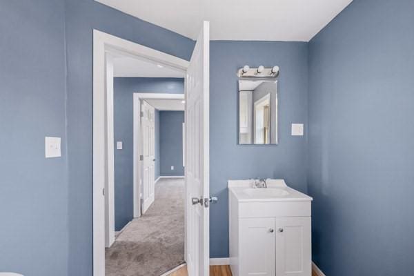 bathroom featuring vanity and baseboards