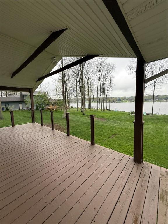 deck featuring a water view and a yard