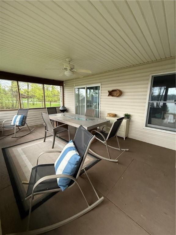 view of patio featuring a ceiling fan and outdoor dining area