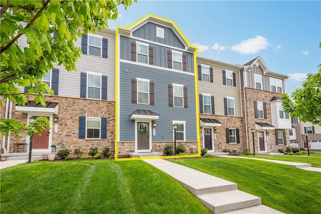 4404 Spruce Rd, Pine Twp Nal, PA 15044 - townhome / multi-family property with board and batten siding, stone siding, and a front lawn