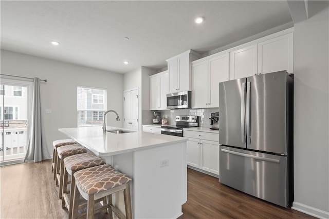 4404 Spruce Rd, Pine Twp Nal, PA 15044 - kitchen with stainless steel appliances, dark wood finished floors, an island with sink, and a sink