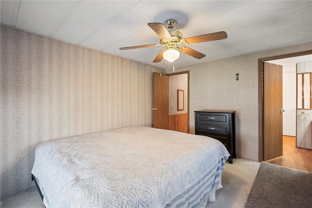 carpeted bedroom with a ceiling fan